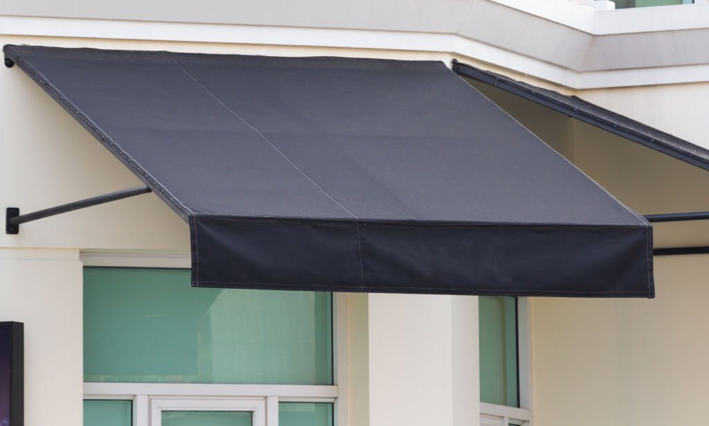 black awning and steel structure over window frame, outdoor house decoration